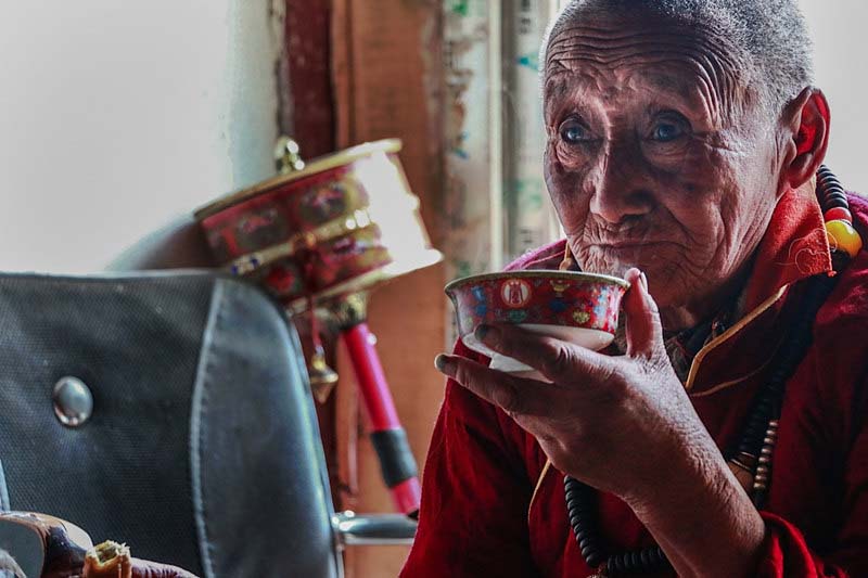 An Old Tibetan Is Drinking Tea